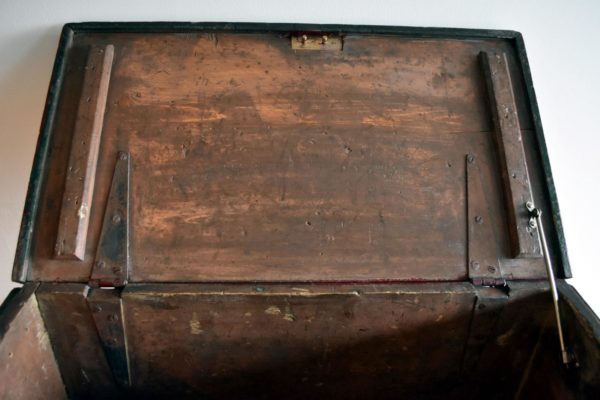 Antique red storage trunk