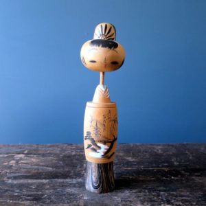 Japanese wooden Kokeshi doll with creative souvenir design
