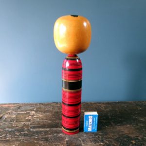 Japanese Kokeshi doll - Tsuchiyu style with bold coloured body and 3D petal design