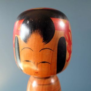 Japanese wooden Kokeshi doll - Tsuchiyu style with red stripe painted body