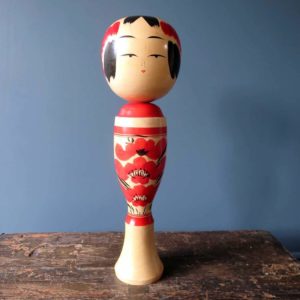 Japanese wooden Kokeshi doll - Sakunami style with chrysanthemum design